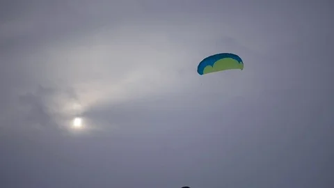 Young people learn to control the kite, launching it into the sky, slow motion Stock Footage 71322297