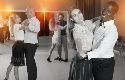 Young people learning to technique of classical dance in dancing class Stock Photos