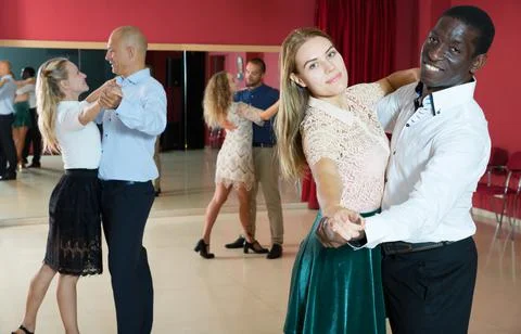Young people learning to technique of classical dance in dancing class Stock Photos