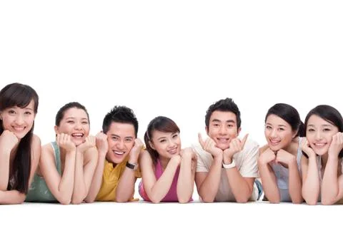 Young people lying on front in a row Stock Photos