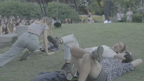 Young people lying on the grass in a park in Buenos Aires, Argentina Stock Footage 345138071