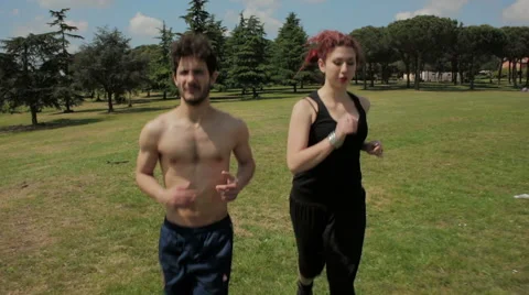 Young people make physical activity running in a park,steadycam shot Stock-Footage 41761070