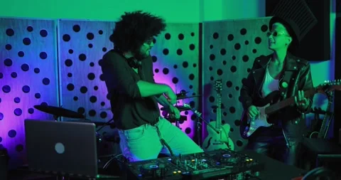 Young people playing music inside a recording studio Vidéo 153403729