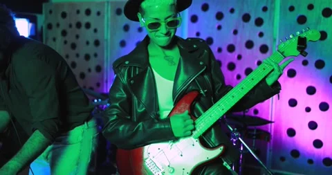 Young people playing music inside a recording studio Видео 153403769