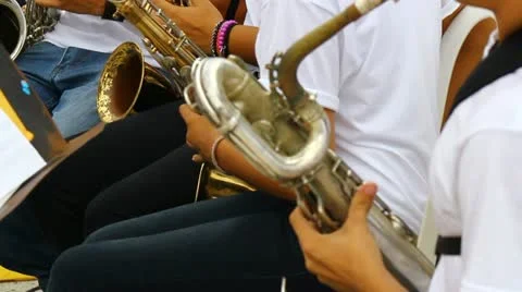 Young people playing saxo in band 1 Stock Footage