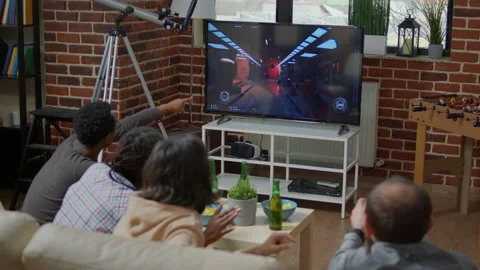 Young people playing video games together and losing 스톡 동영상 189238341