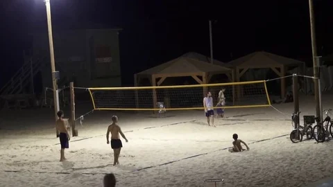 Young people playing volleyball without hands Stock Footage 70526328