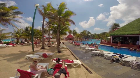 Young people in the pool area of a re3sort during Spring Break Stock Footage 47753957