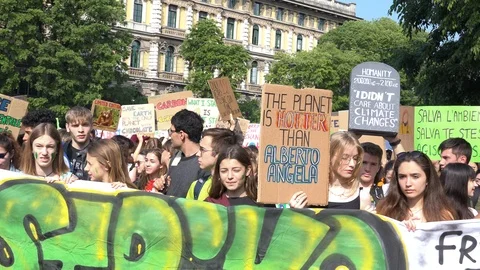 Young people protesting with picket signs, Friday for future, Milan Italy Stock Footage 110761096