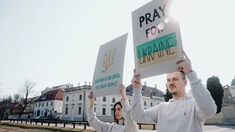 Young people with raised posters calling to stop the war in Ukraine 스톡 동영상 171933388