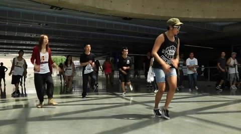Young people repeating dancing moves after professional dancer Stock Footage 53088779