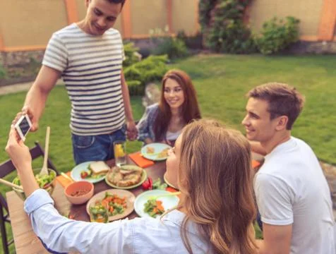 Young people resting outdoors Stock Photos