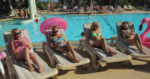 Young people resting by the pool Video stock 93770855