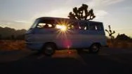Young People On Road Trip Drive Old Van At Sunset Stock Footage