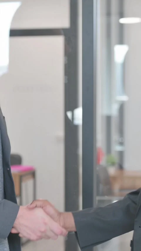 Young People Shaking Hand while Meeting in Office, vertical video Video stock 324699550