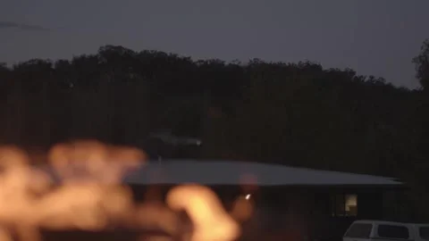 Young People Sitting Fire Camp Looking at the sky Stock Footage 254459699