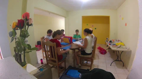 Young People Sitting at Table Preparing Crafts Stock Footage 34032042