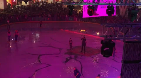 Young people skating on a mall ice rink, disco lights, fun, sport, indoors Stock Footage 33069907