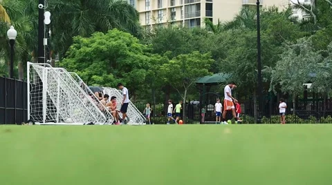 Young people at soccer field practicing and hanging out Stock Footage 51112554