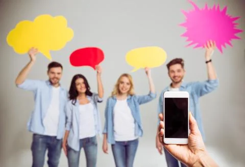Young people with speech bubbles Stock Photos