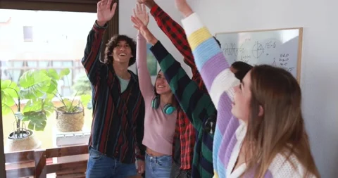 Young people stacking hands together Stock Footage 164378137
