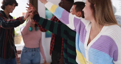 Young people stacking hands together - Diverse culture students celebrating Stock Footage 164378175