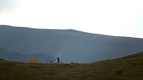 Young people starts a fire at mountain camp. 스톡 동영상 44518960
