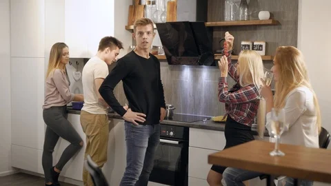 Young people talking in kitchen Stock Footage 99092979