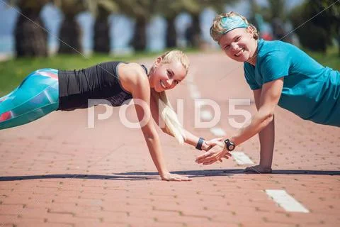 Young people training push up exercise together Stock Photos