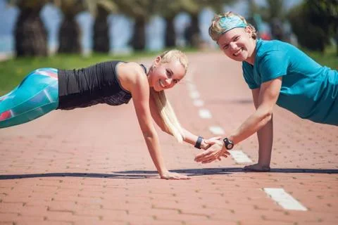 Young people training push up exercise together Stock Photos