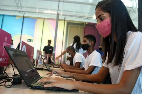 Young people using computer in social project Foto stock