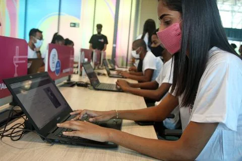 Young people using computer in social project Foto stock