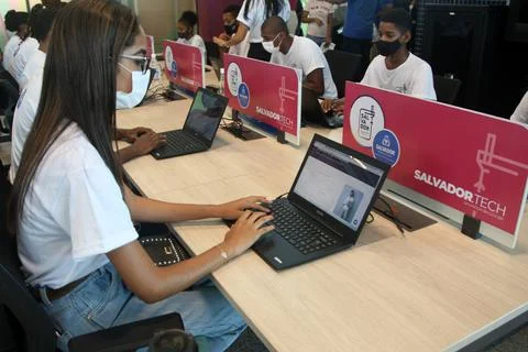 Young people using computer in social project Stockfoto's