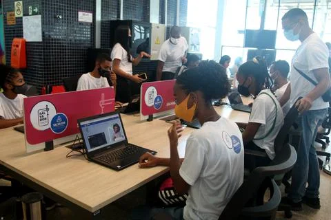 Young people using computer in social project Stock-Fotos