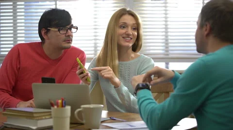 Young people using different electronic gadgets in the office. Slow motion. Stock Footage 60568406
