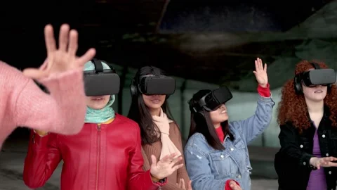Young people using futuristic virtual reality headset - Metaverse concept Video stock 202089951