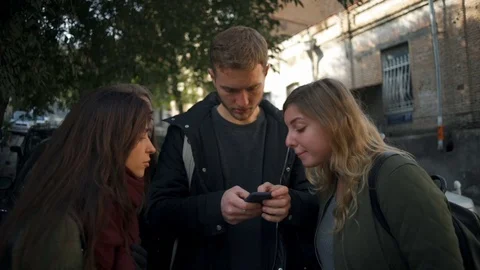 Young people using smartphone to find the right way slow motion Video stock 70229978