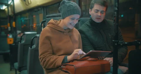 Young people using tablet computer in the bus Stock Footage 51706945