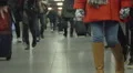 Young people walking in long corridor at airport terminal or railway station HD Footage