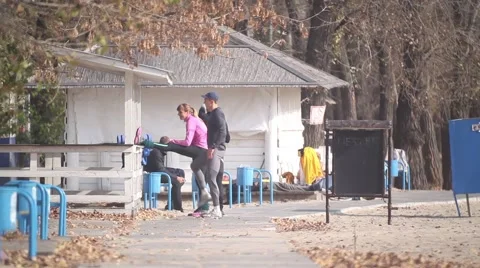 Young people warm up before exercise. young people exercise outdoors Stock Footage 45944383