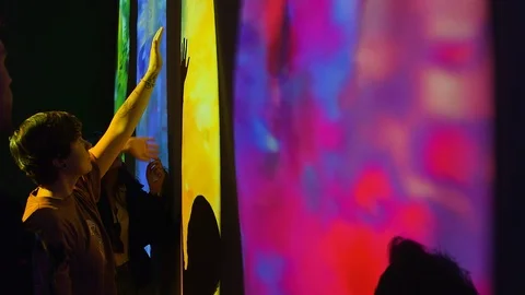 Young people Watching and interacting Video Art installation 1 Stock Footage 126594598
