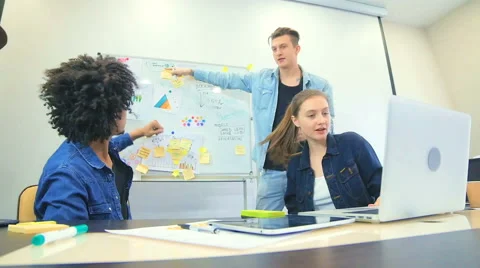 Young people work on the project on construction of entertainment center Stock Footage 60787044