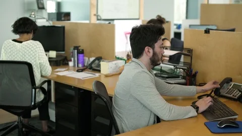 Young people working in an office Stock-Footage 77093974