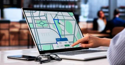 Young Person Browsing Online Map Pins To Find Local Coffee Shop. Stock Photos