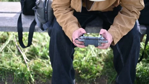 Young person flying a drone Stock Footage 336637612