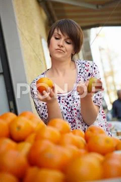 Young Person In A Fruit Stall