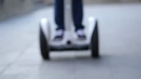 A young person having fun riding on a two-wheeled, self-balancing, battery-power 库存影片 62779252