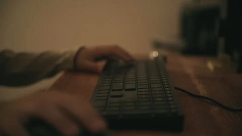Young person operating a desktop computer keyboard at home. Digital lifesty.. Stock-Footage 343626779
