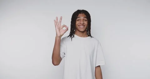 Young person shows different hand signs for communication in a bright indoo.. Stock-Footage 328248560