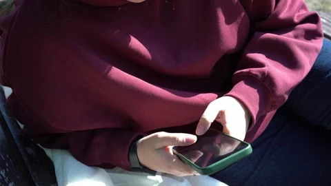 Young person sitting and using smartphone indoors, social media addiction Stock-Footage 318371194